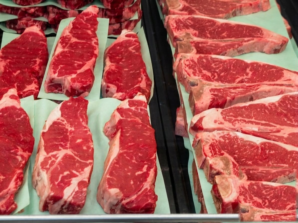Fresh cut strip steaks and T-bones in the case at Sunset Meat Market in Piqua, Ohio